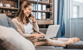 woman seated at home using laptop