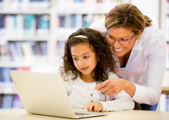 woman and child using laptop computer